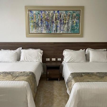 Hotel Royal Elim International Cali Exterior photo A room at the hotel