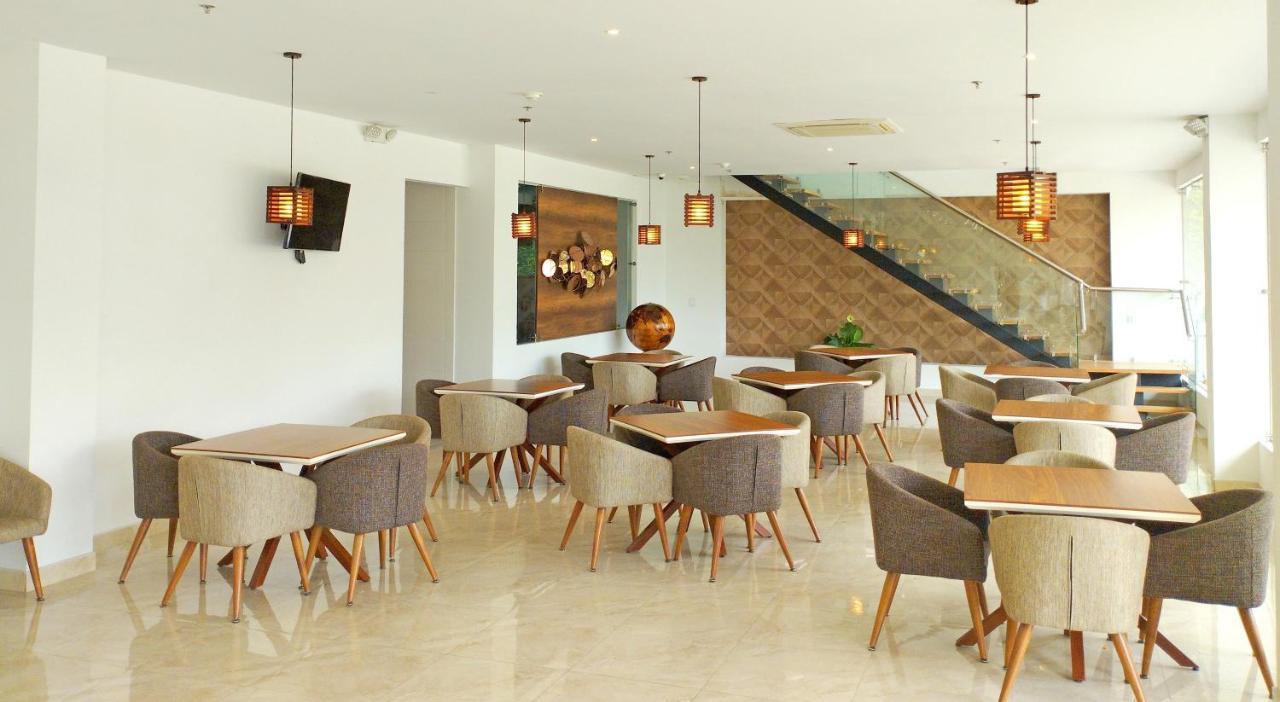 Hotel Royal Elim International Cali Exterior photo The interior of the restaurant