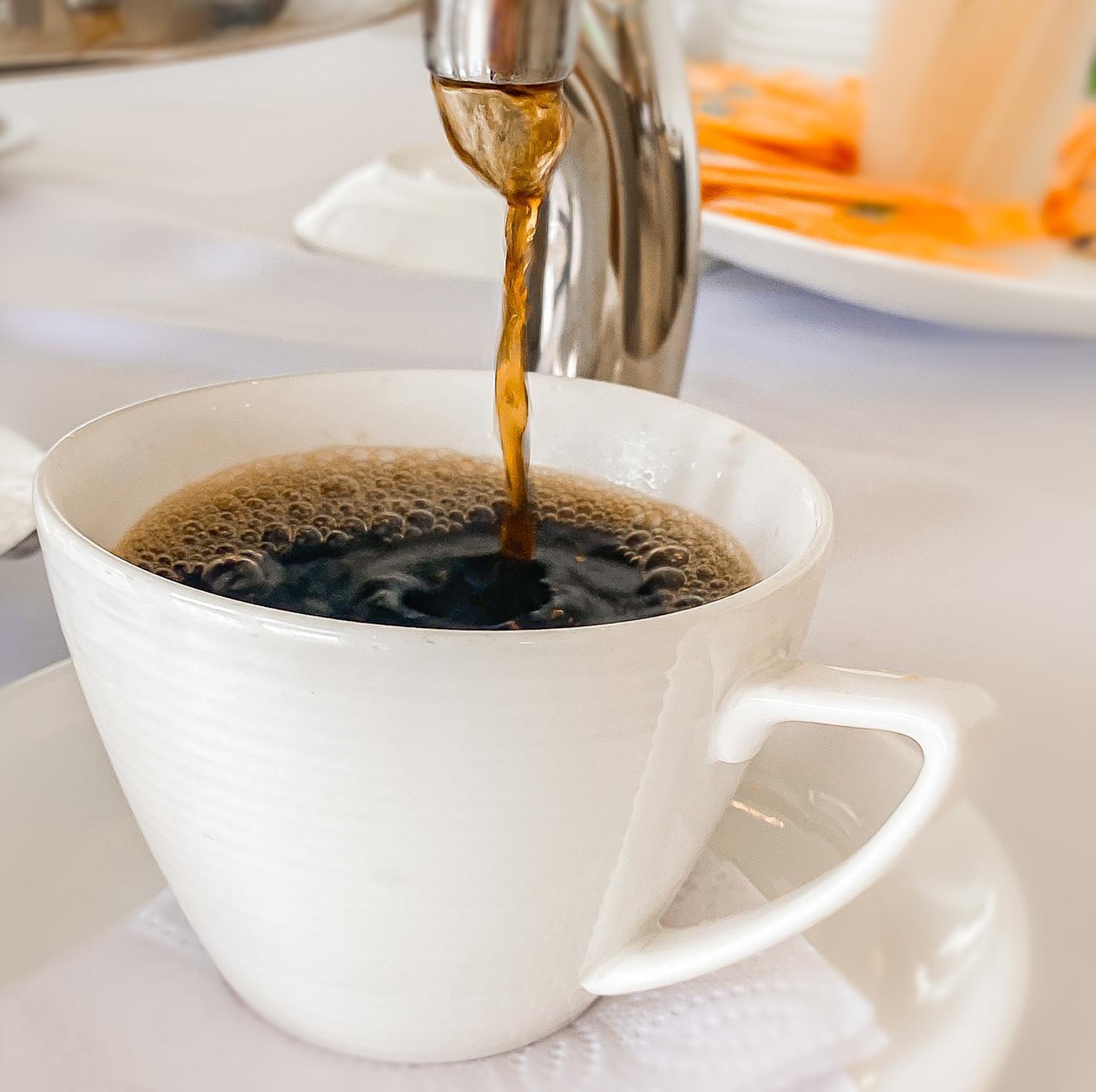 Hotel Royal Elim International Cali Exterior photo Coffee being poured