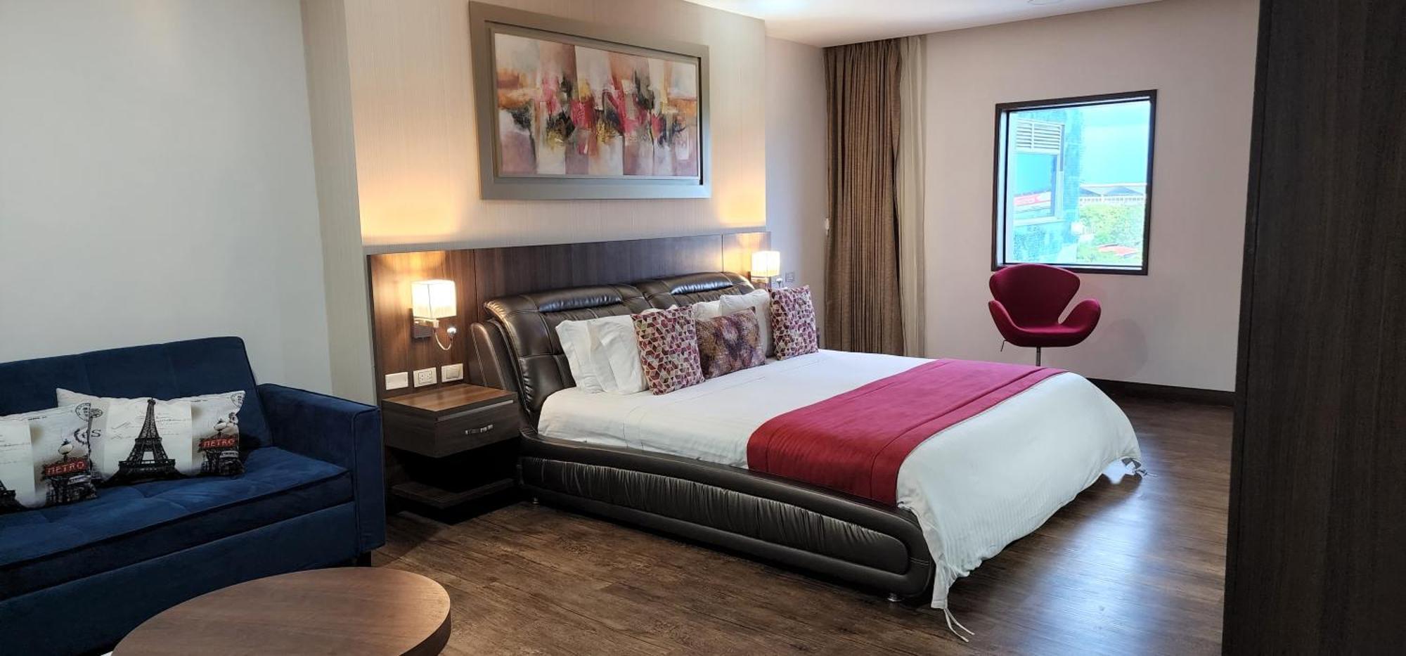 Hotel Royal Elim International Cali Exterior photo A bedroom at the hotel