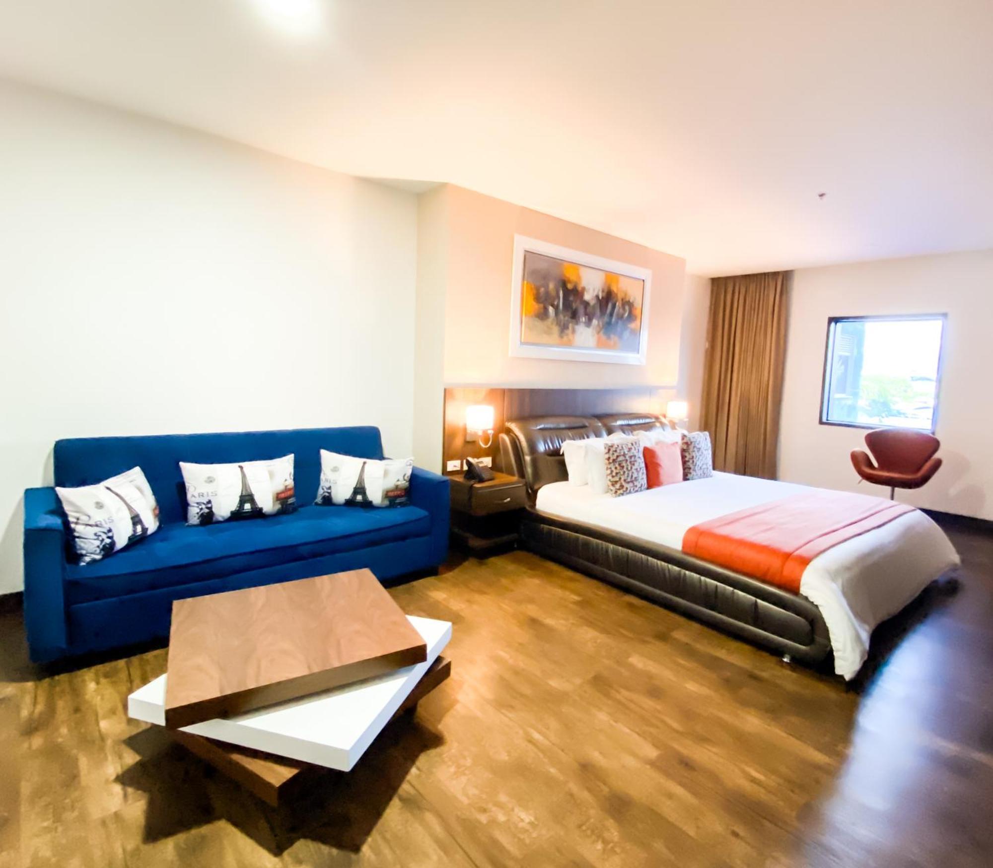 Hotel Royal Elim International Cali Exterior photo A room at the hotel