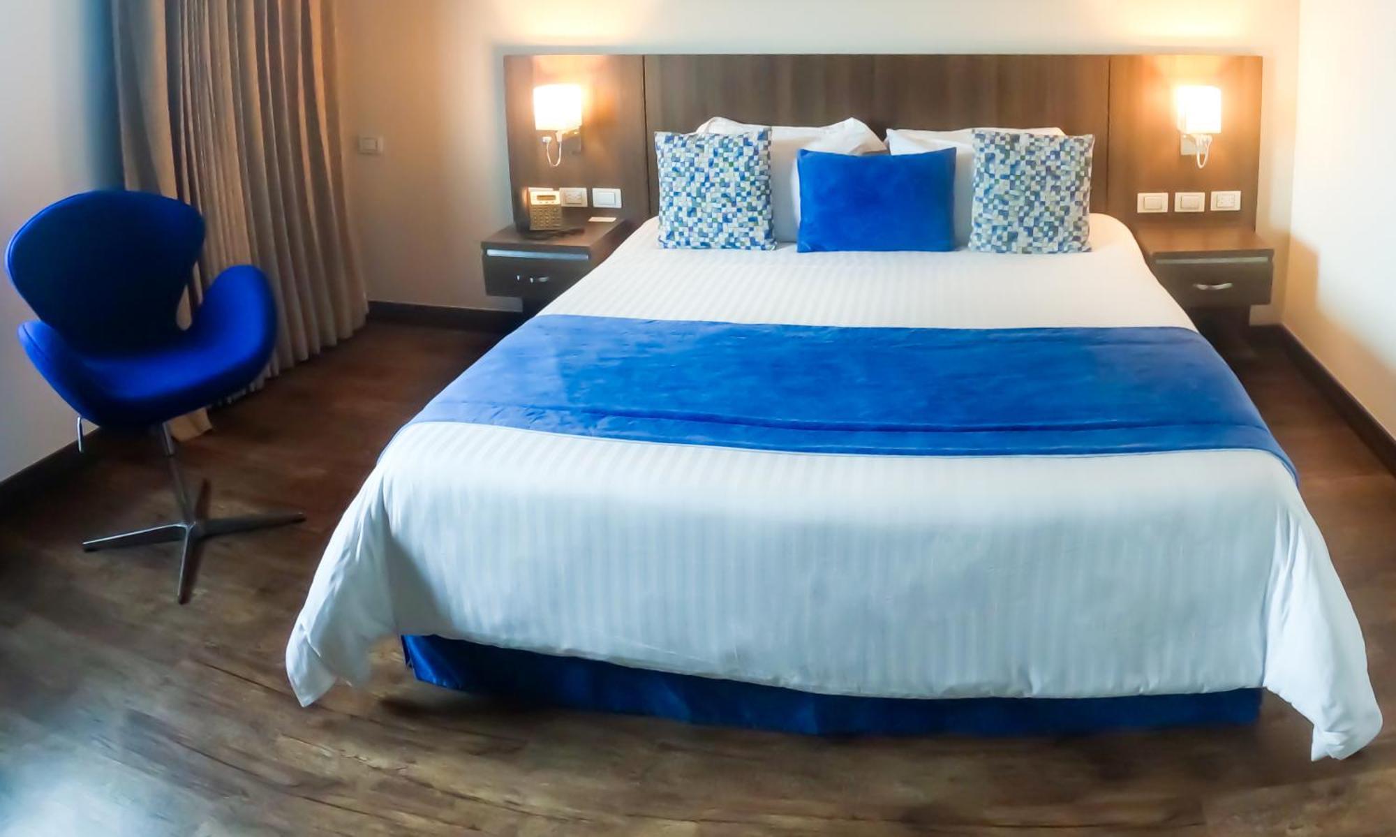 Hotel Royal Elim International Cali Exterior photo A bedroom at the hotel
