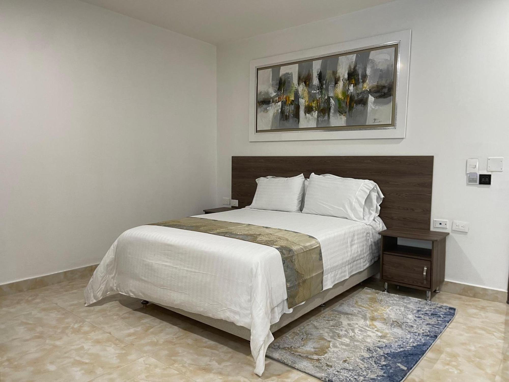 Hotel Royal Elim International Cali Exterior photo A bedroom in the hotel