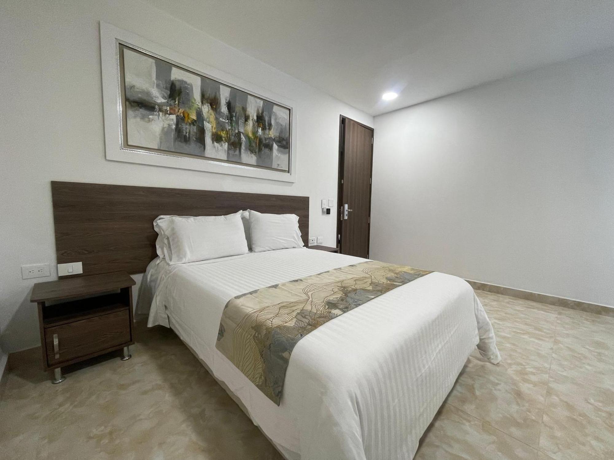 Hotel Royal Elim International Cali Exterior photo A bedroom in a hotel
